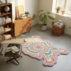Colorful abstract rug in a room with books, plants, and furniture.