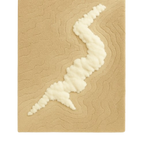 Beige textured rug with a white abstract design Cream Rug – a luxury handcrafted rug inspired by the gentle rhythm of shoreline waves, made by Rugoora.