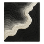 Rug with wavy pattern in black, gray, and white. Mono Rug – a luxury handcrafted monochrome rug combining sculptural balance and modern calm by Rugoora
